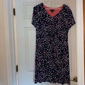 Navy with coral accents, size 14, polyester/ spandex, machine wash/dry. New.